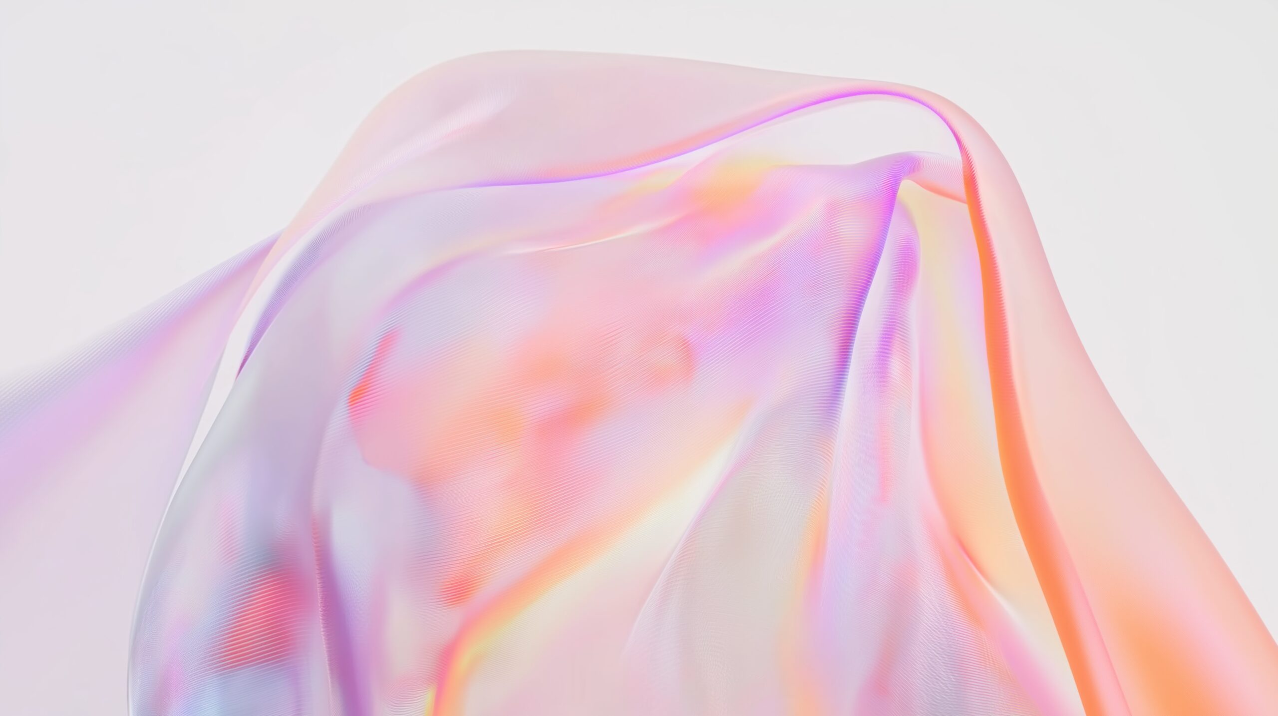 Pastellfärgat, genomskinligt tyg sveps mjukt över en suddig bakgrund med ljusa färgskiftningar.