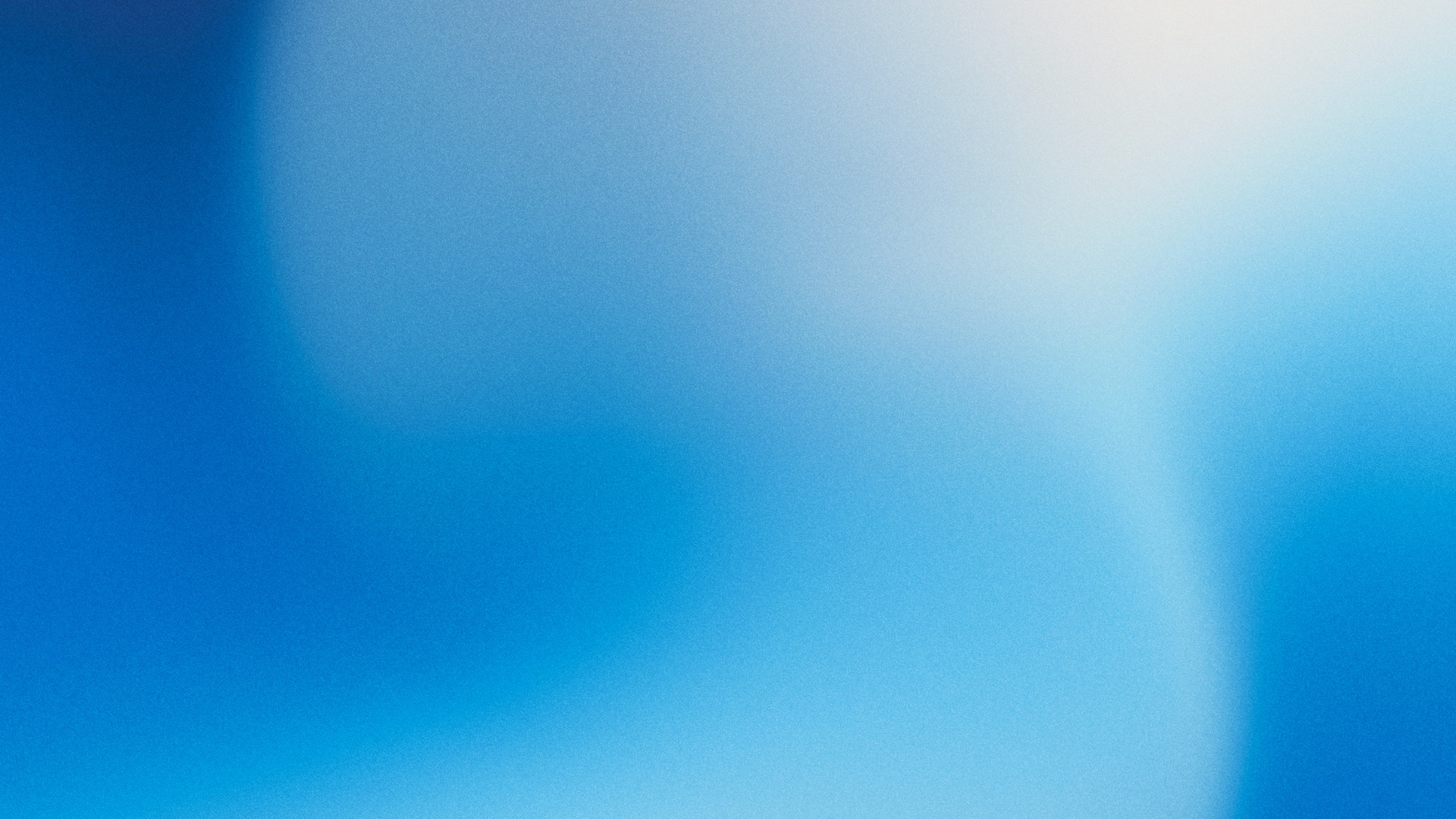 Blue and white abstract blurred gradient background with soft light and subtle texture.